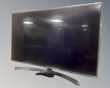 An LG 43" smart TV with remote.