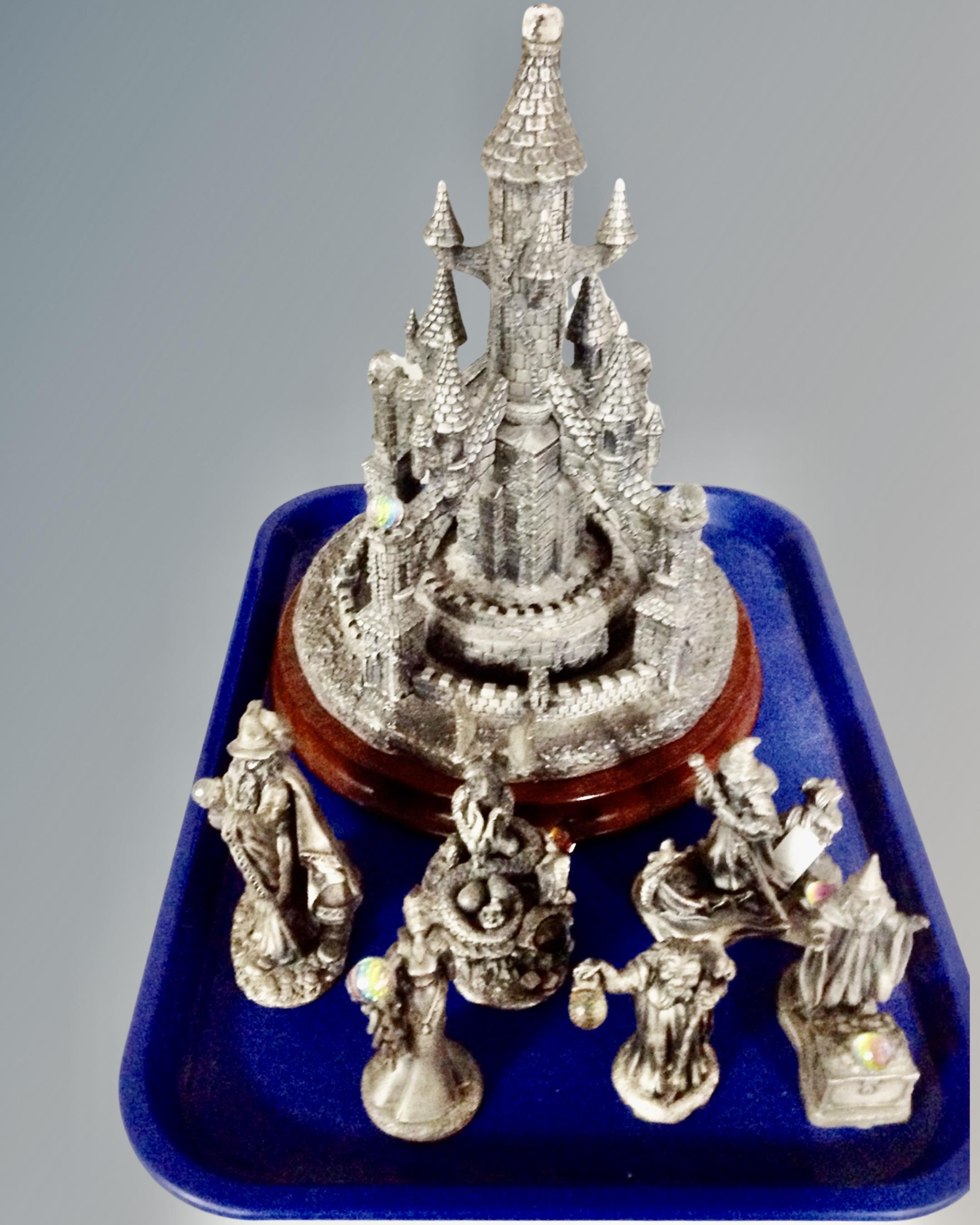 A tray containing seven pewter figures with crystal elements including The Hobbit, Gandalf,