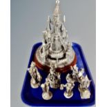 A tray containing seven pewter figures with crystal elements including The Hobbit, Gandalf,
