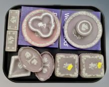 A tray containing 11 pieces of boxed and unboxed pink and purple Wedgwood Jasperware.