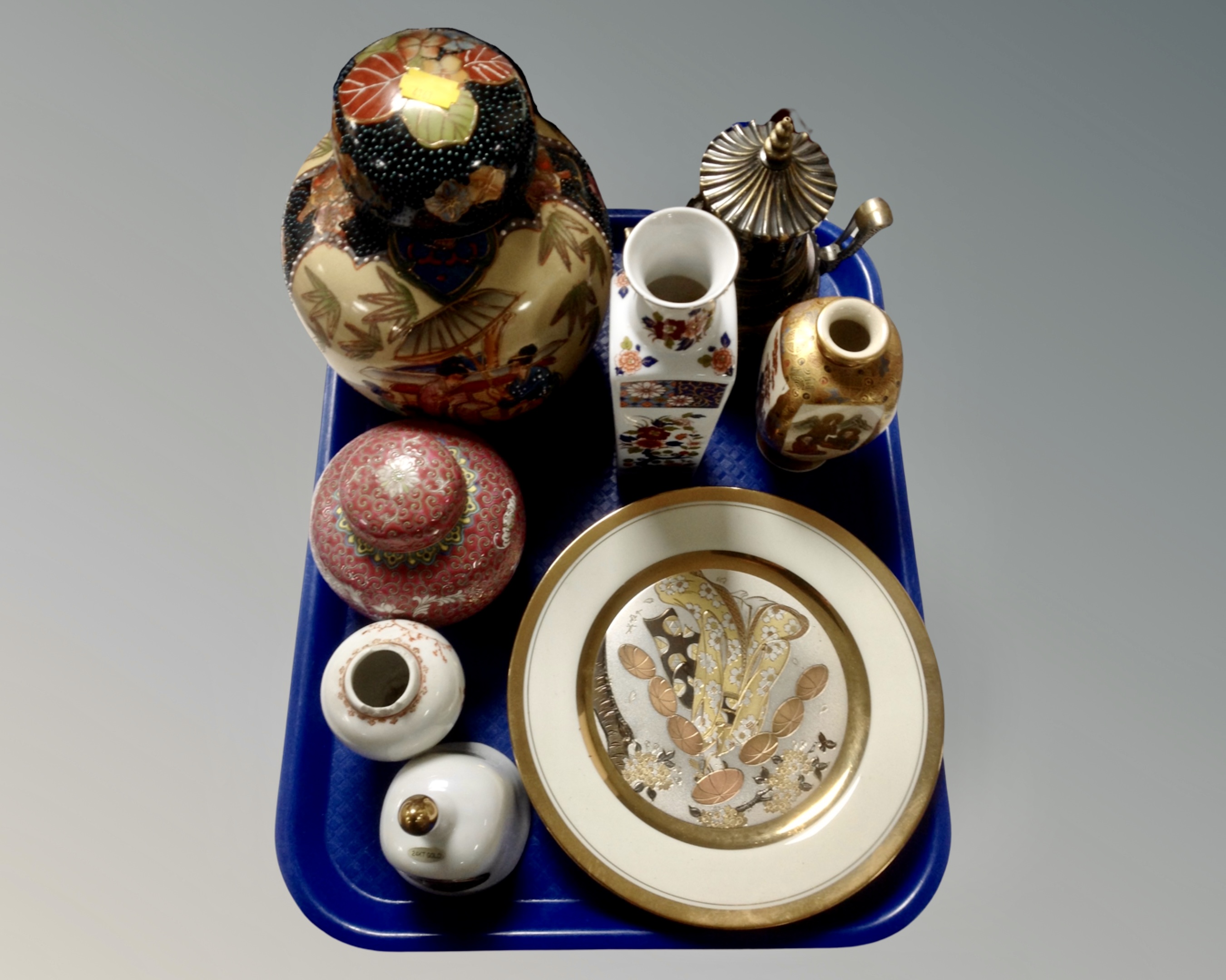 A tray containing Oriental ceramics.