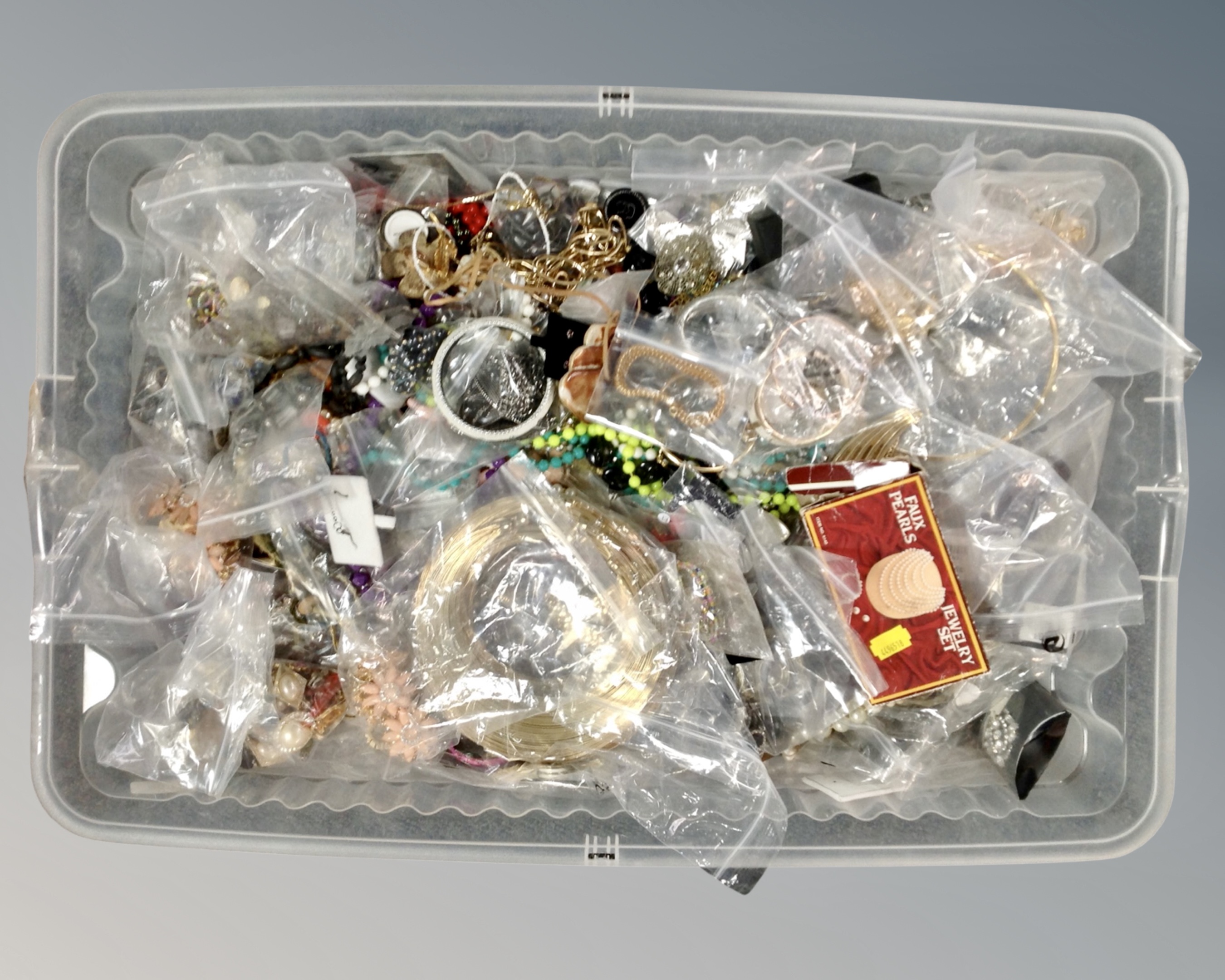 A box containing a large quantity of costume jewellery.