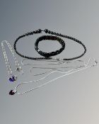 Three silver chains and pendants and a Hematite necklace and bracelet
