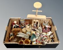 A box containing contemporary figurines, graduated tankards, glass tiger's head paperweight etc.