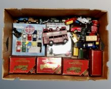 A box containing a quantity of boxed and unboxed die cast vehicles including Matchbox Models of