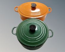 Two cast iron Le Creuset lidded oven dishes.