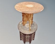 Two circular carved Indian occasional tables.
