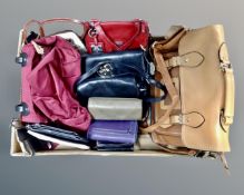 A box containing a quantity of assorted leather handbags and purses.