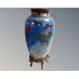 A Japanese Meiji period cloisonné vase on blue ground depicting birds and foliage, height 31cm,