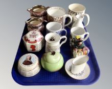 A tray containing assorted ceramics including commemorative tankards and mugs,