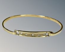 A yellow gold bangle set with diamonds, approx 6cm diameter, 9.6g.