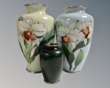 A Japanese green cloisonne vase, height 9 cm and two further vases decorated with flowers, 18.