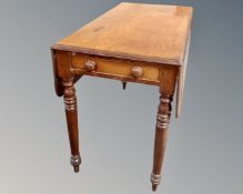 A Victorian mahogany Pembroke table fitted with a drawer (length 104cm)