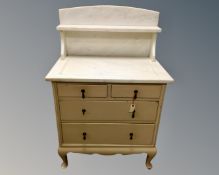 An early 20th century marble topped painted wash stand,