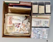 A box containing eight stamp albums and files containing a large quantity of world stamps together