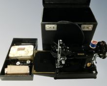 A 20th century Singer electric sewing machine, in case.
