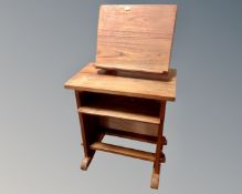 A stained pine occasional table with undershelf and music stand (width 54cm)