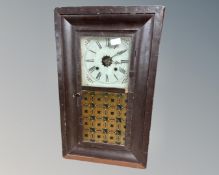 A 19th century American wall clock in painted case