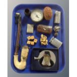 A tray containing a vintage pipe, Dalvey hip flask, pocket lighters, treen egg, snuff box,