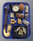 A tray containing a vintage pipe, Dalvey hip flask, pocket lighters, treen egg, snuff box,
