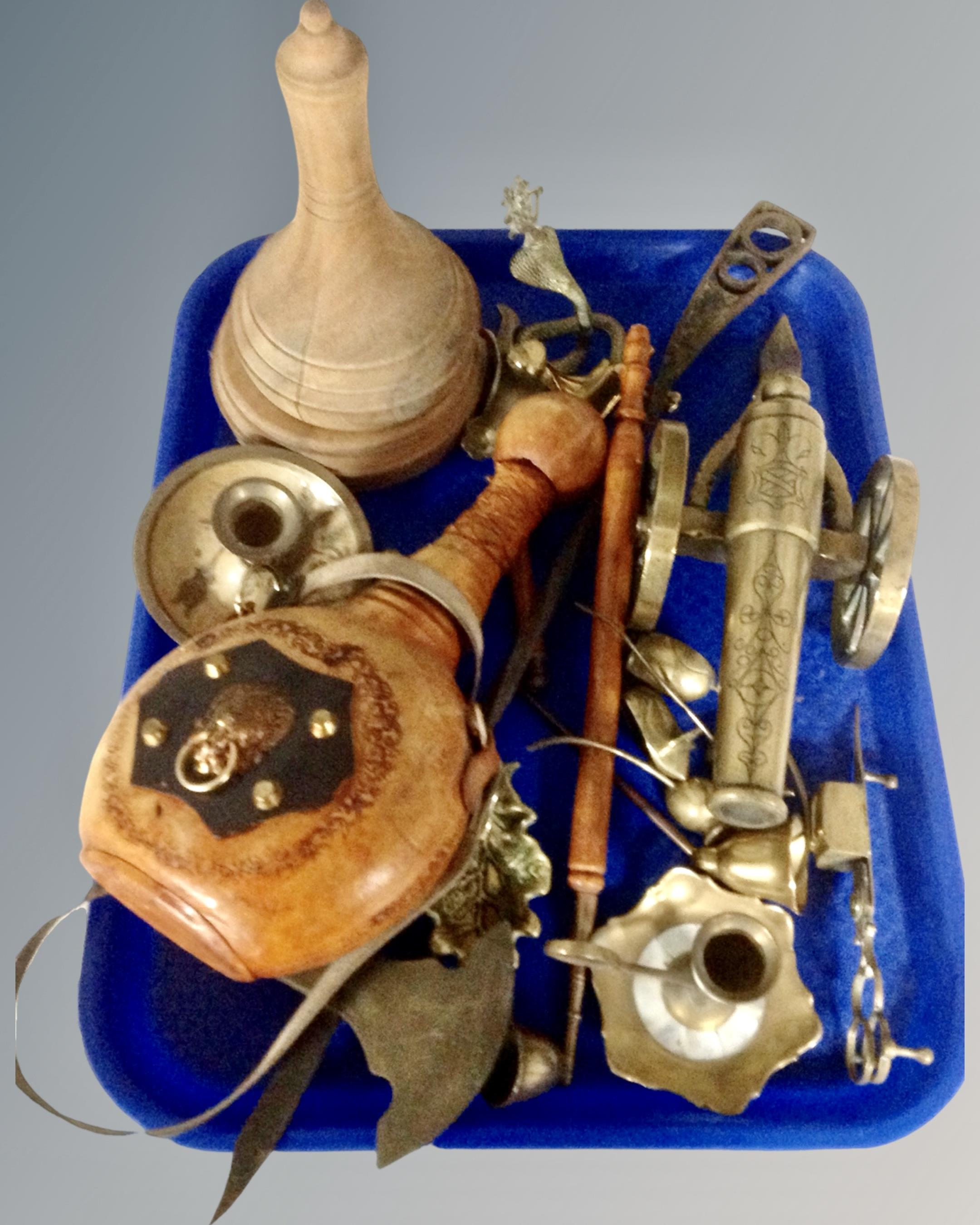 A tray containing assorted metal wares including a brass cannon, ornaments, candlesticks,