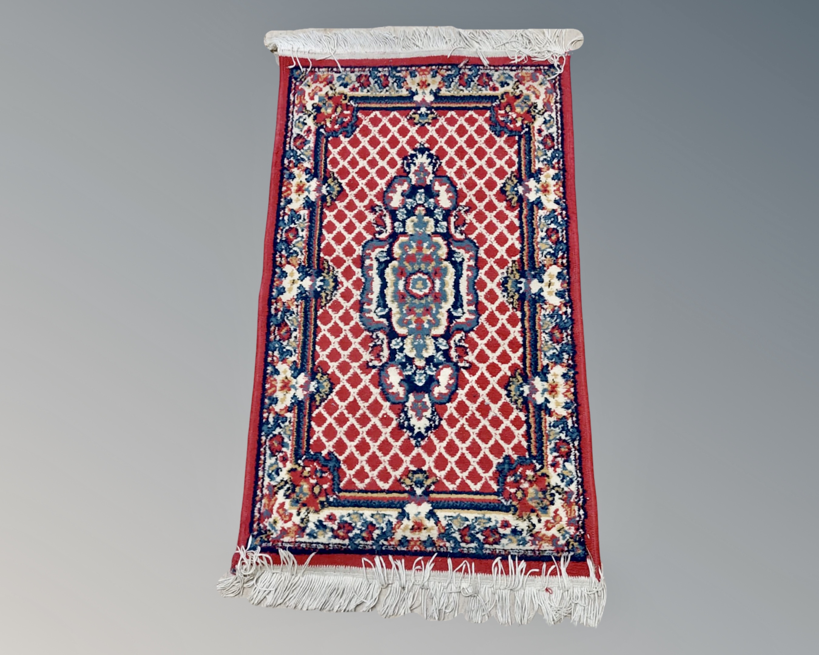 A small eastern woollen rug,