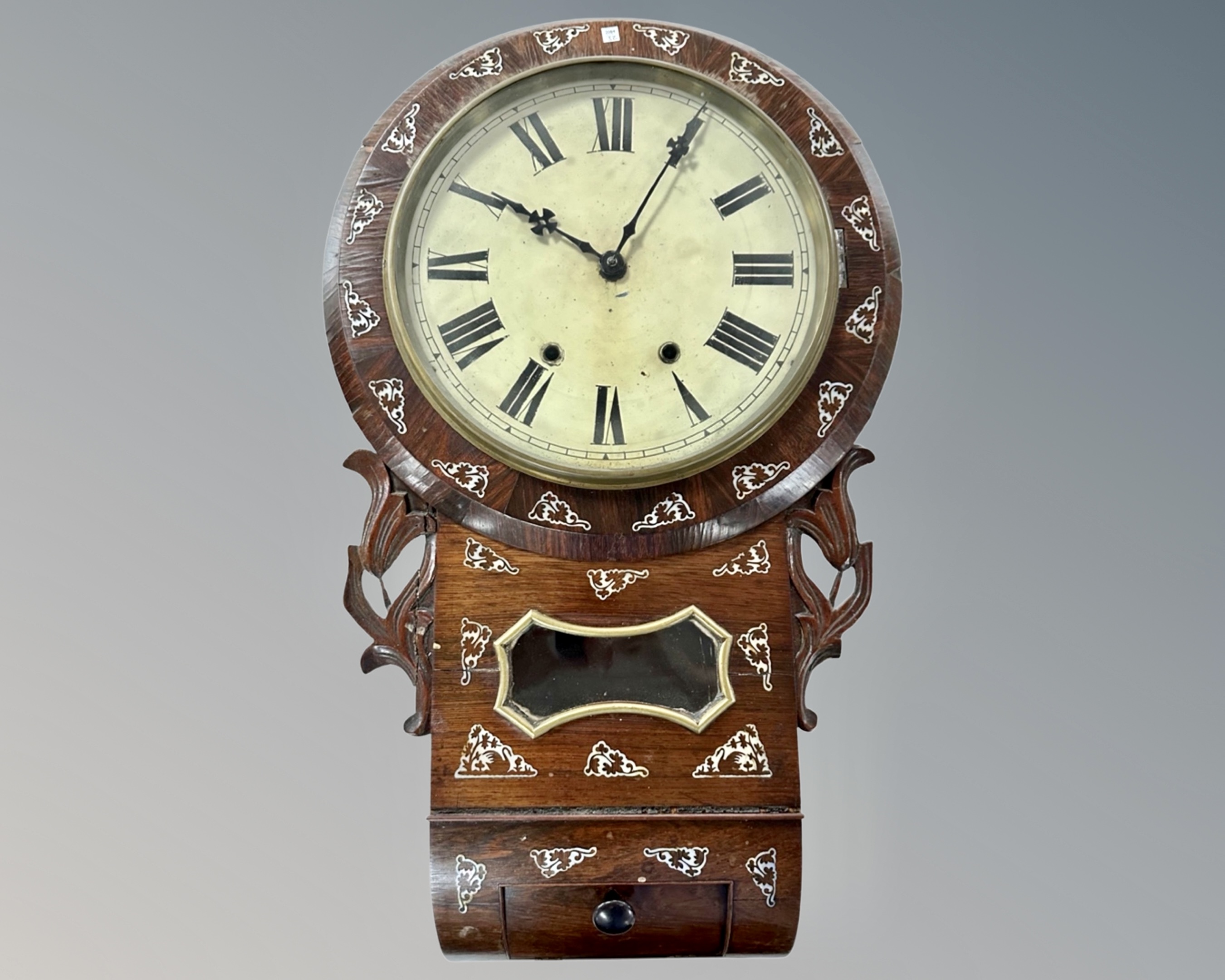 A Victorian rosewood drop dial wall clock with mother of pearl inlay.