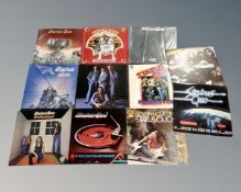 A collection of eleven Status Quo LPs.