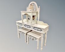 A three drawer dressing table with stool and mirror,
