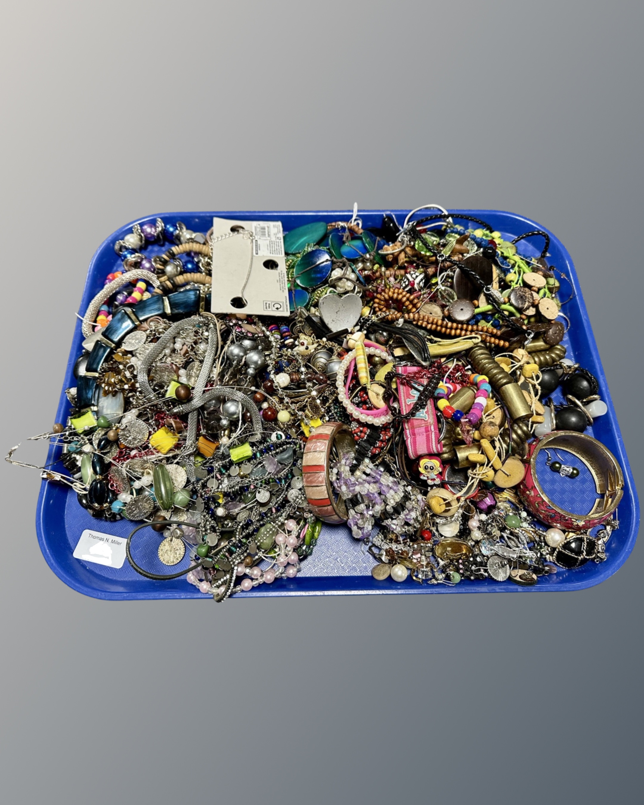 A tray of costume jewellery, bangles,