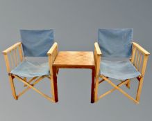 A pair of folding director's style chairs together with a two tier occasional table with chessboard