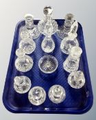 A tray containing 13 cut glass and lead crystal dressing table perfume bottles,