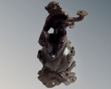 A Chinese bronze figure of a seated monkey, hight 24.