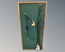 Two vintage pipes mounted on a notice board.
