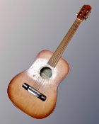 A Sumbro model PS1A acoustic guitar.