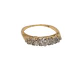 An antique gold five stone diamond ring, size O CONDITION REPORT: 3.8g. Marks worn.