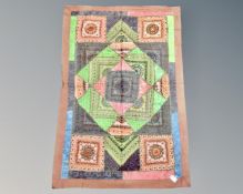An eastern patchwork wall hanging,