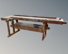 A 20th century Scandinavian woodworking bench fitted with vices (length 245cm)