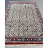 A machine made carpet with all-over Herati motif on cream ground,