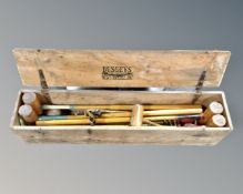 A Busseys Sports and Games croquet set in a pine box.