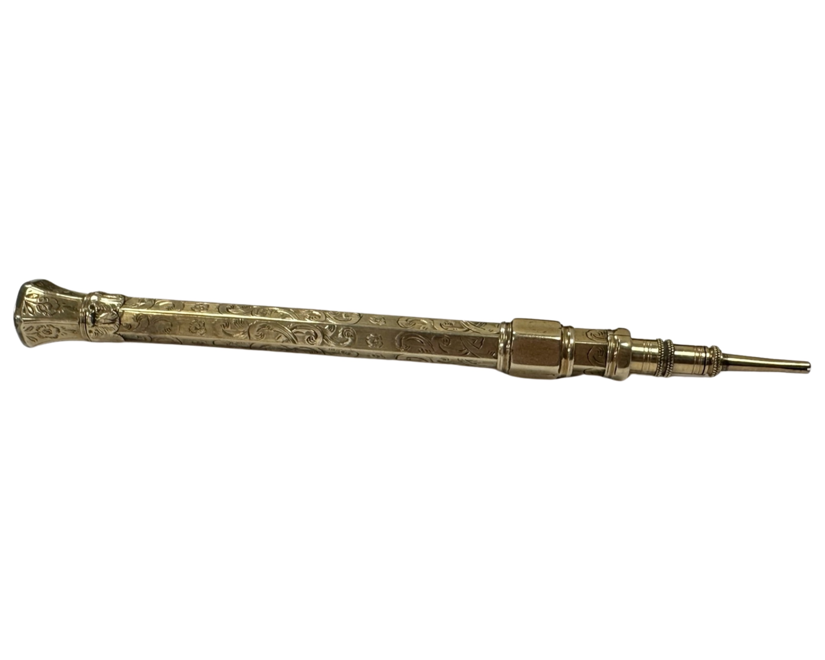 A gold propelling pencil with agate-set finial, length 12cm.