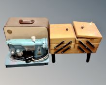 A concertina sewing box together with a Singer electric sewing machine in case.