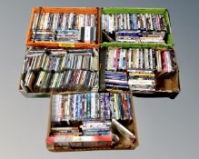 Five boxes containing assorted DVDs and CDs.
