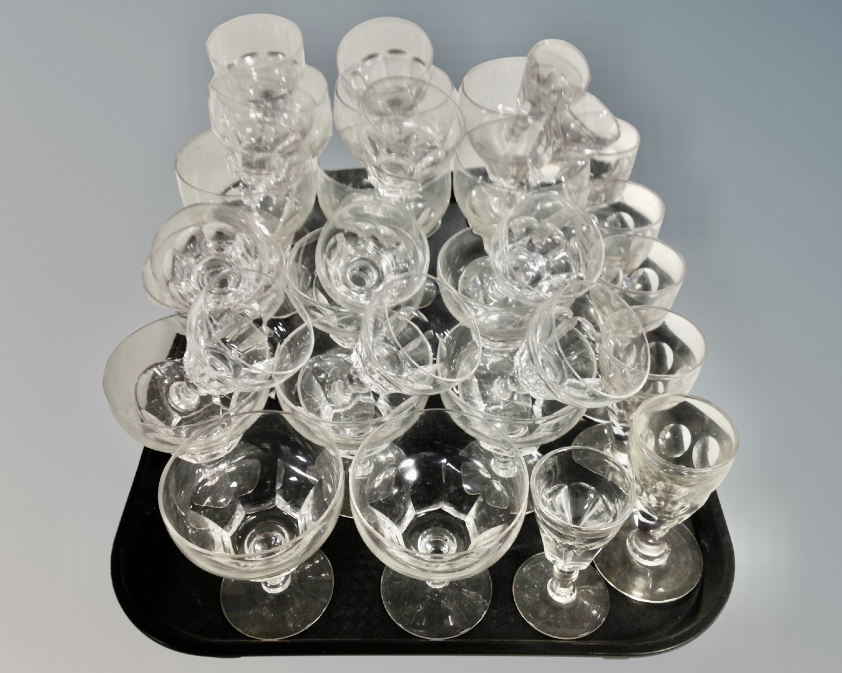 A tray containing a quantity of Edwardian drinking glasses.