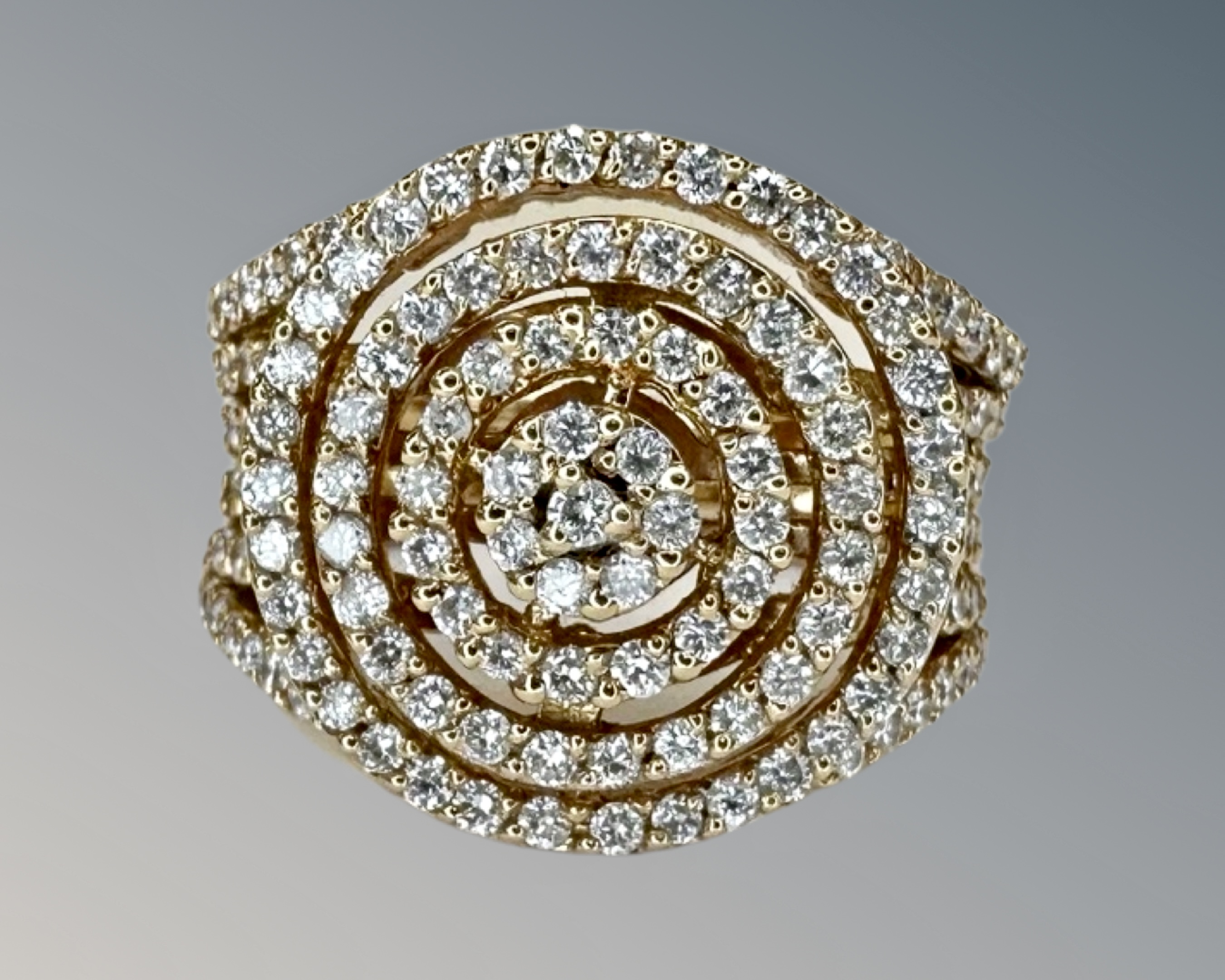 An 18ct gold fancy diamond cluster ring set with approximately 135 diamonds, size M½.