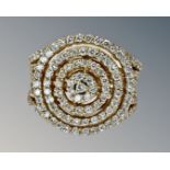 An 18ct gold fancy diamond cluster ring set with approximately 135 diamonds, size M½.