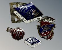A collection of car club badges.