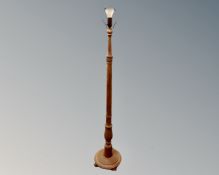 A 20th century carved oak standard lamp. CONDITION REPORT: Continental wiring.