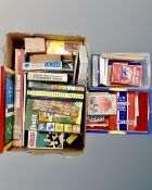 A box and two crates containing vintage board games.