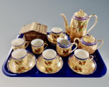 A fifteen piece 20th century Japanese export tea service together with a wooden Swiss chalet